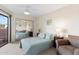 Bright bedroom with a large window, a mirrored closet, and comfortable furnishings at 4141 N 31St St # 405, Phoenix, AZ 85016