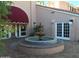 Charming courtyard with fountain, lush landscaping, and inviting entrance at 4141 N 31St St # 405, Phoenix, AZ 85016