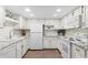 Bright kitchen with white cabinets, granite countertops, and modern appliances at 4141 N 31St St # 405, Phoenix, AZ 85016