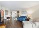 Bright living room features hardwood floors, a blue sofa, and large windows at 4141 N 31St St # 405, Phoenix, AZ 85016