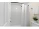 Bright shower with white tile surround, rainfall shower head, and convenient grab bar at 4141 N 31St St # 405, Phoenix, AZ 85016