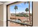 Scenic view from the window showcasing a pool, palm trees, and mountain landscape in the distance at 4141 N 31St St # 405, Phoenix, AZ 85016