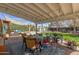 Expansive backyard featuring a covered patio, lush greenery, and various seating areas for outdoor enjoyment at 4225 N 16Th Ave, Phoenix, AZ 85015