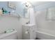 Bright bathroom featuring updated fixtures, wainscotting, and a shower-tub combination at 4225 N 16Th Ave, Phoenix, AZ 85015