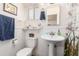 Clean, classic bathroom featuring beadboard walls, a pedestal sink, and a shower-tub combination at 4225 N 16Th Ave, Phoenix, AZ 85015