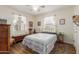 Bright bedroom featuring hardwood floors, natural light, and a decorative bed frame at 4225 N 16Th Ave, Phoenix, AZ 85015