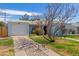 View of charming home, including a paved driveway leading to a single-car garage and inviting front yard at 4225 N 16Th Ave, Phoenix, AZ 85015