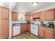 Efficient kitchen with classic cabinets, white appliances, and functional layout perfect for home cooking at 4225 N 16Th Ave, Phoenix, AZ 85015