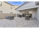 Spacious backyard featuring covered patio with outdoor seating and built-in barbecue at 4370 E Kaibab Pl, Chandler, AZ 85249