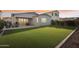 Spacious backyard features artificial grass, covered patio, and outdoor seating area at 4370 E Kaibab Pl, Chandler, AZ 85249