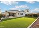 The spacious backyard with lush artificial grass is perfect for outdoor entertaining and relaxation at 4370 E Kaibab Pl, Chandler, AZ 85249