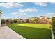 Expansive backyard featuring artificial turf offering a clean, low-maintenance space for recreation at 4370 E Kaibab Pl, Chandler, AZ 85249