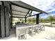 Modern community ramada features a BBQ area, fireplace and counter seating, perfect for outdoor gatherings at 4370 E Kaibab Pl, Chandler, AZ 85249