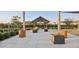 Inviting community space featuring covered seating, planters, and ambient string lights perfect for gathering at 4370 E Kaibab Pl, Chandler, AZ 85249