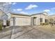 Front exterior showcasing a single-story home with stucco siding, a two-car garage, and neatly landscaped front yard at 4370 E Kaibab Pl, Chandler, AZ 85249