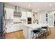 Stylish kitchen featuring stainless steel appliances, white cabinets, and a center island with seating at 4370 E Kaibab Pl, Chandler, AZ 85249