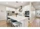 Updated kitchen with a large island, seating, stainless steel appliances, and modern finishes at 4370 E Kaibab Pl, Chandler, AZ 85249
