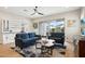 Bright living room with tile floors, two sofas, contemporary decor, and sliding doors to backyard at 4370 E Kaibab Pl, Chandler, AZ 85249