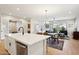 Open living space features dining area, kitchen island, and view of living area at 4370 E Kaibab Pl, Chandler, AZ 85249