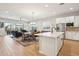 Bright, open floorplan featuring a kitchen island and dining area flowing into the living room at 4370 E Kaibab Pl, Chandler, AZ 85249