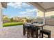 Inviting covered patio with an outdoor table and chairs, perfect for dining al fresco and enjoying backyard views at 4370 E Kaibab Pl, Chandler, AZ 85249