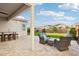 Relaxing covered patio featuring comfortable seating and a serene view of the landscaped backyard at 4370 E Kaibab Pl, Chandler, AZ 85249