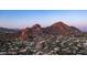 Expansive aerial view of residential homes nestled amidst desert landscape with majestic mountains as a backdrop at 4434 E Camelback Rd # 128, Phoenix, AZ 85018