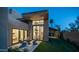 Charming backyard with seating area, desert landscaping, manicured lawn and covered outdoor space adjacent to the home at 4434 E Camelback Rd # 128, Phoenix, AZ 85018