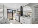Bright bathroom with double vanities, marble countertops, and an outdoor view at 4434 E Camelback Rd # 128, Phoenix, AZ 85018