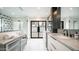 Bright bathroom featuring double marble vanity, modern sinks, and a frameless glass shower at 4434 E Camelback Rd # 128, Phoenix, AZ 85018