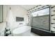 Bright bathroom showcasing a modern soaking tub, walk-in shower, and designer finishes at 4434 E Camelback Rd # 128, Phoenix, AZ 85018