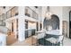 Stylish kitchen with emerald cabinetry, white countertops, stainless steel appliances, and modern lighting at 4434 E Camelback Rd # 128, Phoenix, AZ 85018
