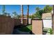 Desert landscaping featuring mature trees, plants, and artificial turf alongside walkways, enhancing curb appeal at 4434 E Camelback Rd # 128, Phoenix, AZ 85018