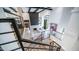 An aerial view of the living room with sleek furniture, modern fireplace, and open floorplan at 4434 E Camelback Rd # 128, Phoenix, AZ 85018