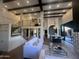 Open living area with staircase, living room, and kitchen/dining that is perfect for entertaining at 4434 E Camelback Rd # 128, Phoenix, AZ 85018