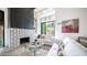 Cozy living room with a modern fireplace, comfortable seating, and bright natural light at 4434 E Camelback Rd # 128, Phoenix, AZ 85018