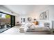 Bright bedroom with sliding doors to outdoor seating area, stylish furniture and decor, and a modern design at 4434 E Camelback Rd # 128, Phoenix, AZ 85018
