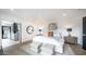 A serene bedroom featuring plush bedding, a stylish ensuite bathroom, and modern decor at 4434 E Camelback Rd # 128, Phoenix, AZ 85018