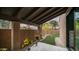 Cozy covered patio with lush greenery and beautiful potted plants, perfect for outdoor living at 4434 E Camelback Rd # 128, Phoenix, AZ 85018