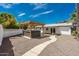 Wide shot of backyard showcasing a new hot tub with a custom pergola, desert landscaping, and covered patio at 4721 N 24Th St, Phoenix, AZ 85016