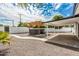 Expansive backyard featuring a new hot tub with a custom pergola, desert landscaping and a covered patio at 4721 N 24Th St, Phoenix, AZ 85016