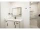Modern bathroom with white cabinets, quartz countertops, updated fixtures, and a luxurious shower at 4721 N 24Th St, Phoenix, AZ 85016