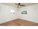 Bright bedroom features two windows, a ceiling fan, and modern flooring at 4721 N 24Th St, Phoenix, AZ 85016