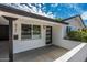Inviting exterior featuring a white brick facade, black trim, and a modern front door, complete with manicured landscaping at 4721 N 24Th St, Phoenix, AZ 85016
