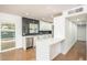 Bright kitchen featuring sleek countertops, white cabinetry, stainless steel appliances, and a modern backsplash at 4721 N 24Th St, Phoenix, AZ 85016