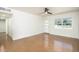 Sun-filled living room with stylish ceiling fan, modern lighting, and a contemporary door, all enhancing the open space at 4721 N 24Th St, Phoenix, AZ 85016