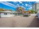 Spacious backyard features a pergola-covered hot tub, gravel landscaping, and a privacy fence at 4729 N 24Th St, Phoenix, AZ 85016