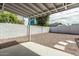 Open backyard space with gravel, pavers and a covered patio with views of city buildings at 4729 N 24Th St, Phoenix, AZ 85016