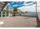 Backyard with gravel, hot tub under a pergola, and a view of nearby city buildings at 4729 N 24Th St, Phoenix, AZ 85016