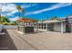 Backyard with gravel, hot tub under a pergola, and a view of the home at 4729 N 24Th St, Phoenix, AZ 85016